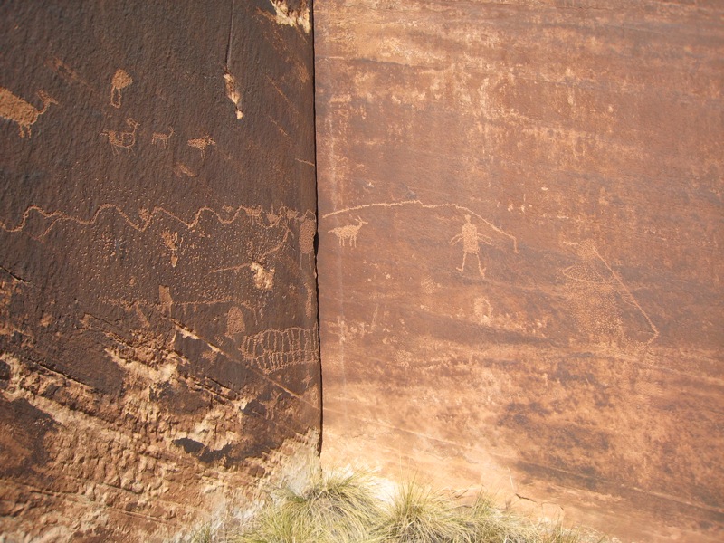 Petroglyphs cover lots of Blue Gramma cliff