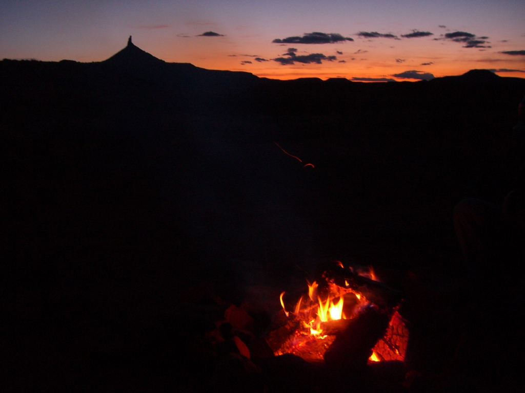 Campfire warms us up as the sun sets behind the Six Shooters